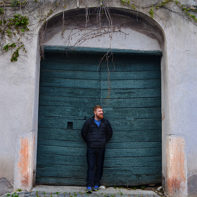 David in front of old door