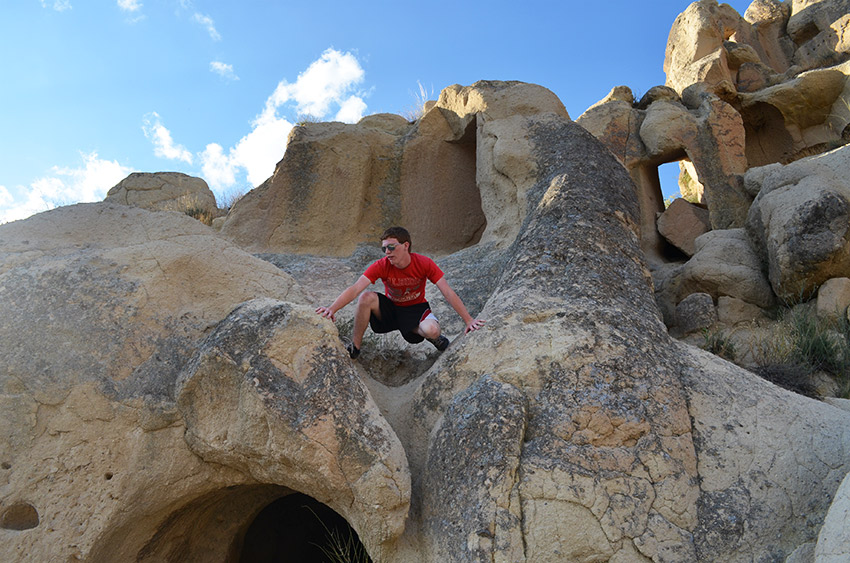 Sam climbing rocks